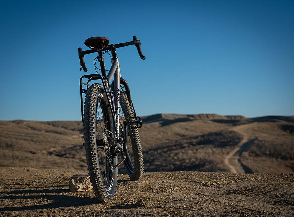 Custom mountain bike outside on dirt trail